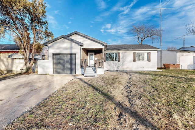 single story home featuring a garage and a front lawn