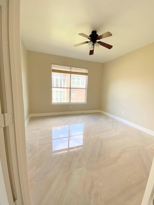 unfurnished room featuring ceiling fan