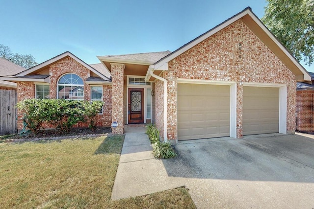 ranch-style home with a garage and a front lawn