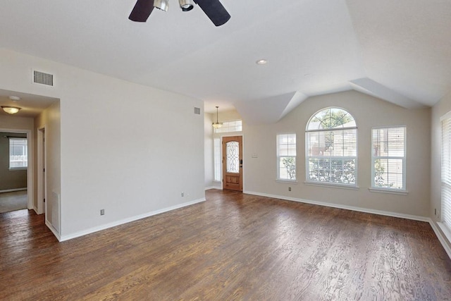 unfurnished living room with ceiling fan, lofted ceiling, and dark hardwood / wood-style flooring