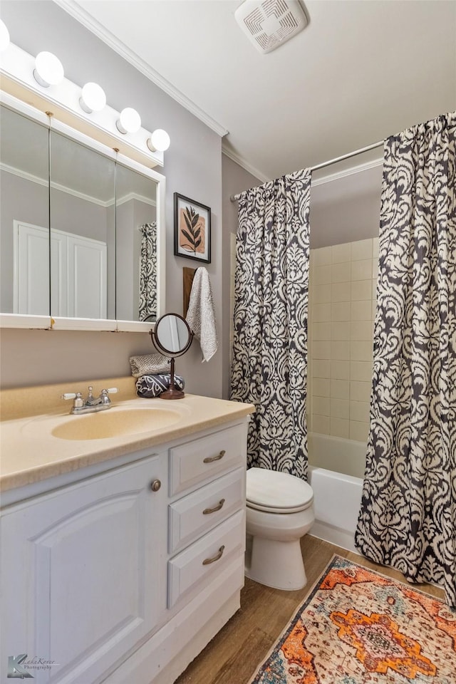 full bathroom featuring wood-type flooring, vanity, toilet, shower / tub combo with curtain, and crown molding