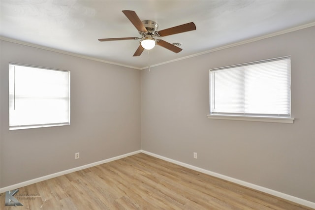 spare room featuring ceiling fan, ornamental molding, and light wood-type flooring