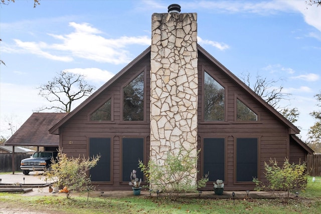 back of property with a carport