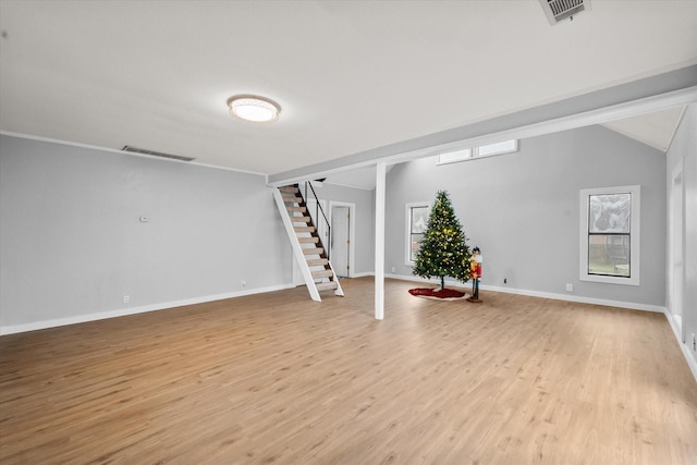 basement with light hardwood / wood-style floors