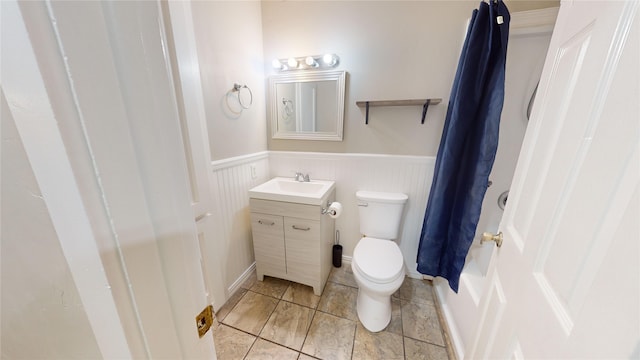 bathroom featuring toilet and vanity