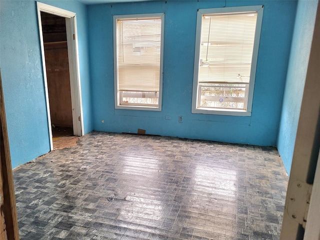 1308 Harrington Ave, Fort Worth, TX 76164 - unfurnished bedroom with multiple windows