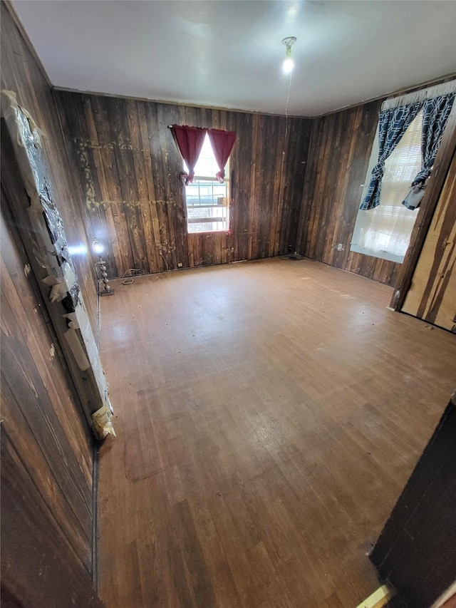 1308 Harrington Ave, Fort Worth, TX 76164 - unfurnished room featuring wood walls and wood finished floors