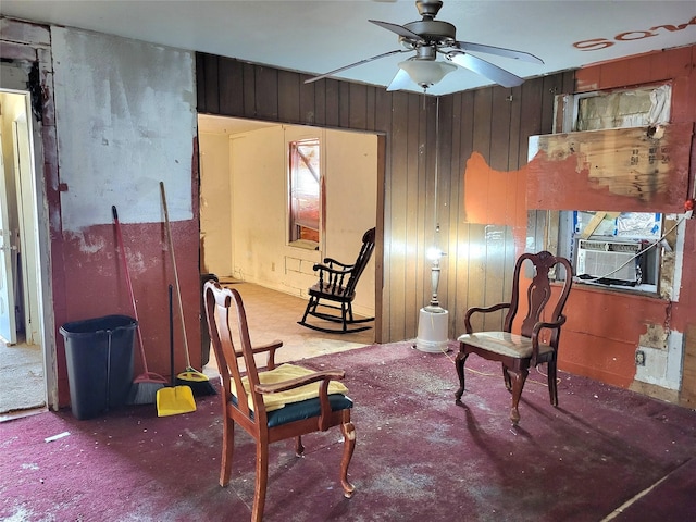 1308 Harrington Ave, Fort Worth, TX 76164 - sitting room featuring a ceiling fan, cooling unit, and wood walls