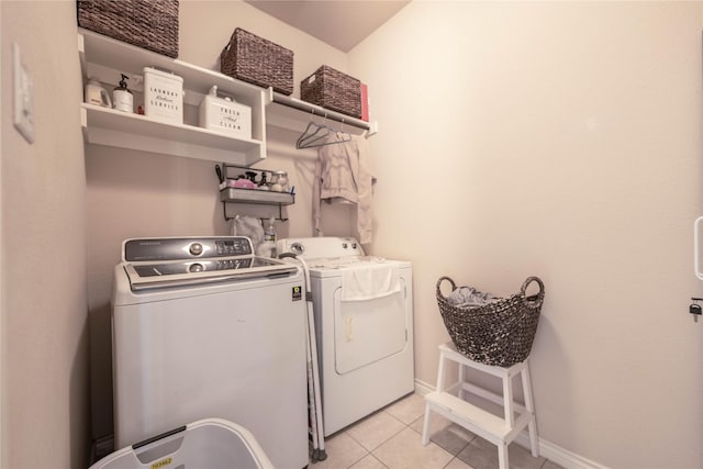 washroom with light tile patterned flooring and independent washer and dryer