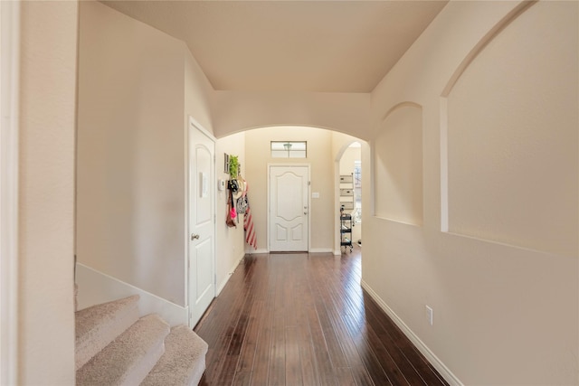 foyer entrance with dark hardwood / wood-style floors