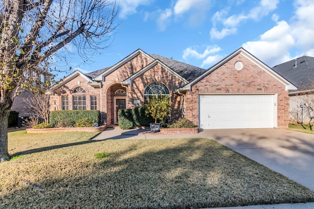 view of front of home with a garage and a front yard