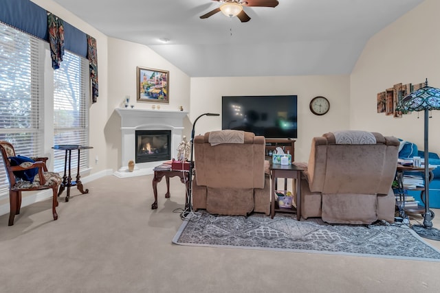 living room featuring vaulted ceiling, ceiling fan, and carpet floors