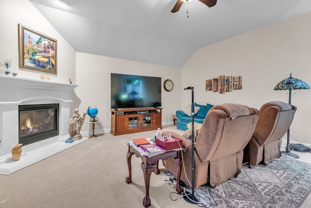 living room featuring ceiling fan, carpet, and lofted ceiling