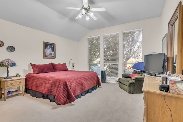 bedroom featuring ceiling fan, light colored carpet, multiple windows, and lofted ceiling