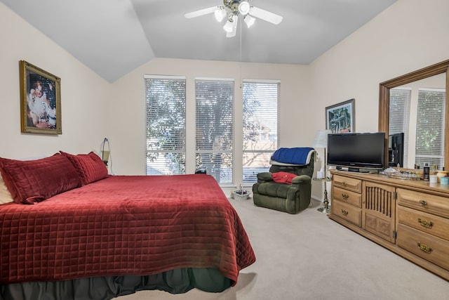 bedroom featuring ceiling fan, lofted ceiling, and carpet floors