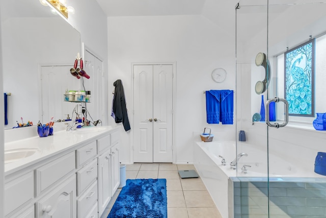 bathroom with vaulted ceiling, vanity, independent shower and bath, and tile patterned flooring