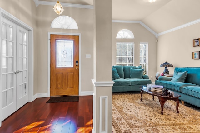 entryway featuring a wealth of natural light, crown molding, and lofted ceiling