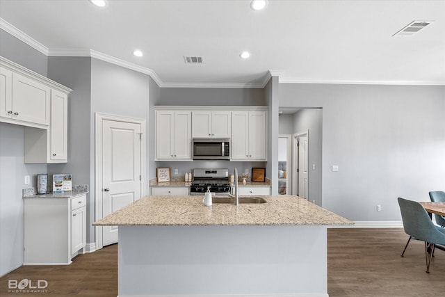 kitchen featuring white cabinetry, visible vents, and appliances with stainless steel finishes