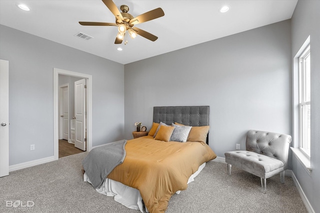 carpeted bedroom with recessed lighting, visible vents, baseboards, and ceiling fan