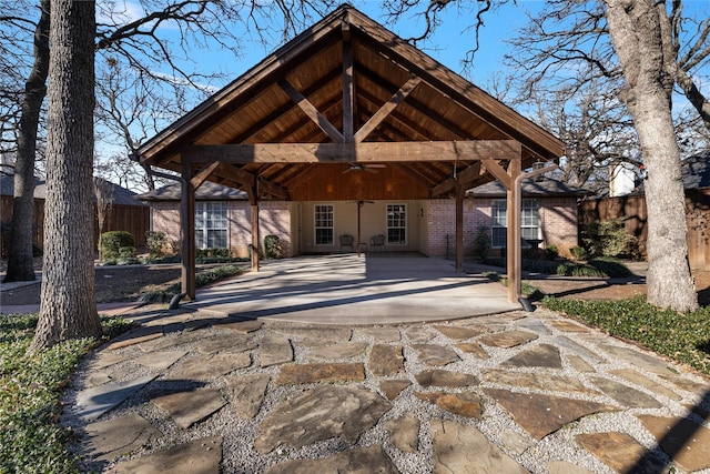 exterior space featuring ceiling fan and a patio area