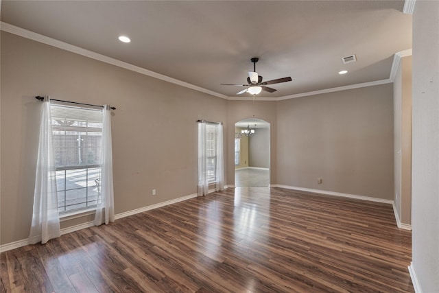 empty room with crown molding, dark hardwood / wood-style flooring, and ceiling fan with notable chandelier