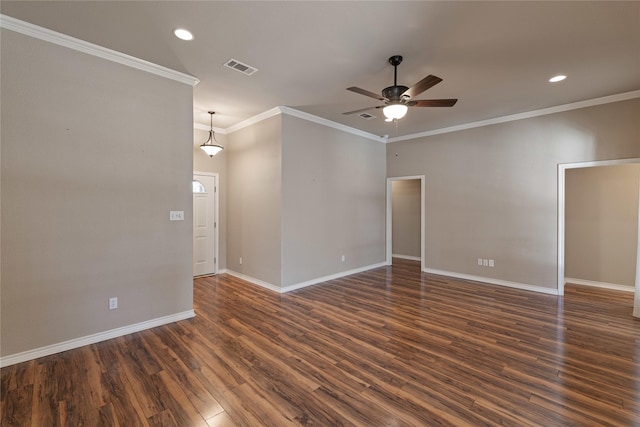 empty room with ceiling fan, dark wood-type flooring, and ornamental molding