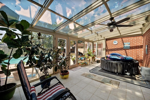 sunroom featuring french doors and a ceiling fan