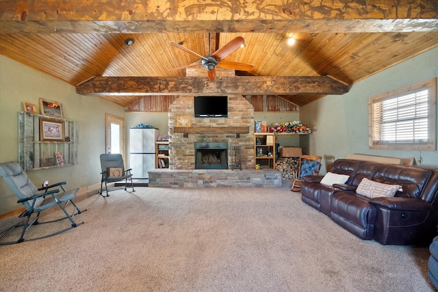 living area with a stone fireplace, wooden ceiling, and a healthy amount of sunlight