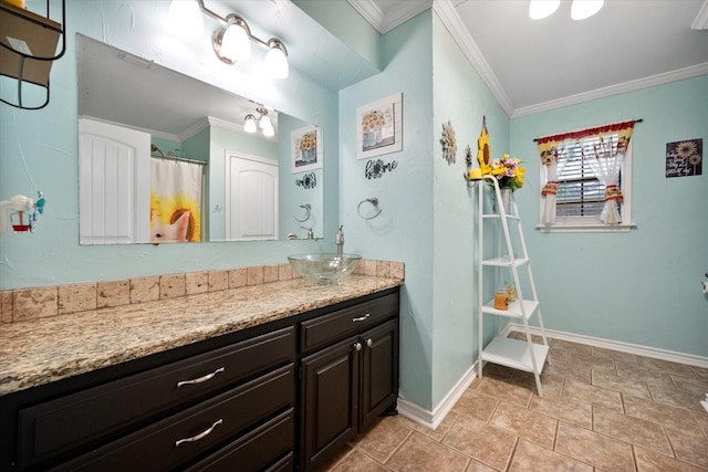 bathroom with ornamental molding, a shower with shower curtain, vanity, and baseboards