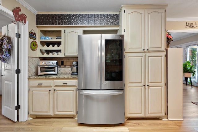 kitchen with open shelves, ornamental molding, refrigerator with glass door, and light wood-style flooring