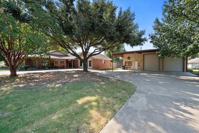 single story home featuring a garage and a front lawn