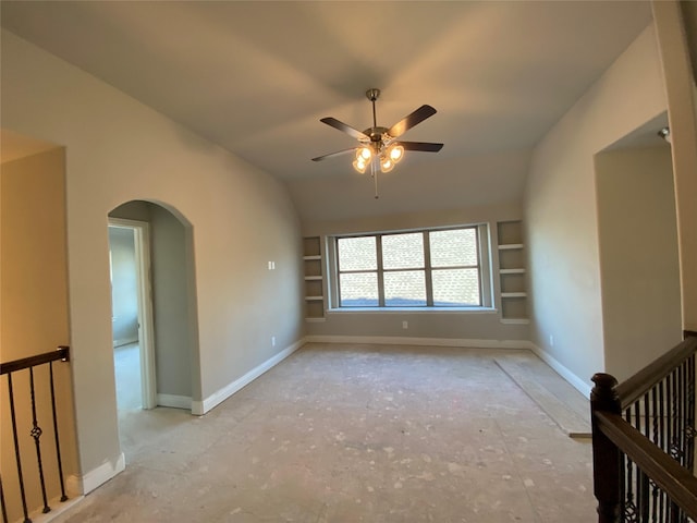 spare room featuring ceiling fan, lofted ceiling, and built in features