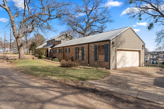 view of home's exterior featuring a garage and a yard