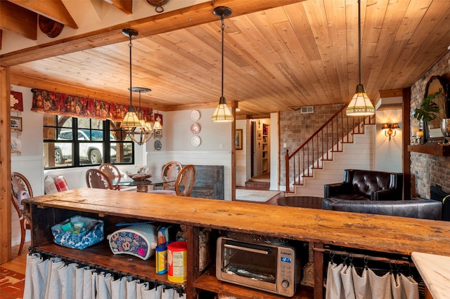 dining space featuring a notable chandelier, wood ceiling, and beamed ceiling