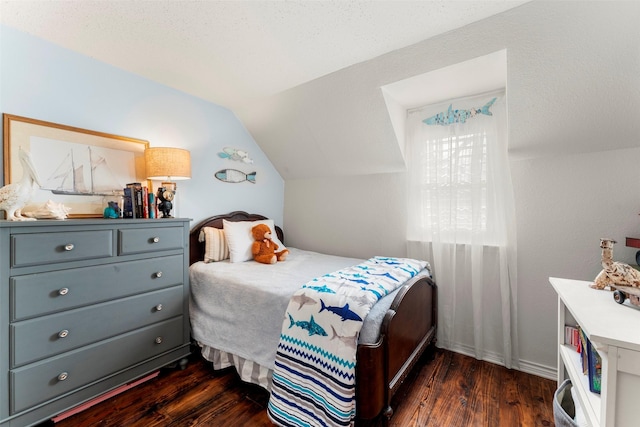 bedroom featuring dark wood-type flooring and lofted ceiling