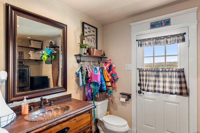 bathroom with toilet and vanity