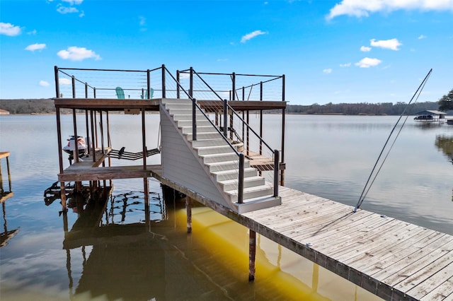 view of dock with a water view and boat lift