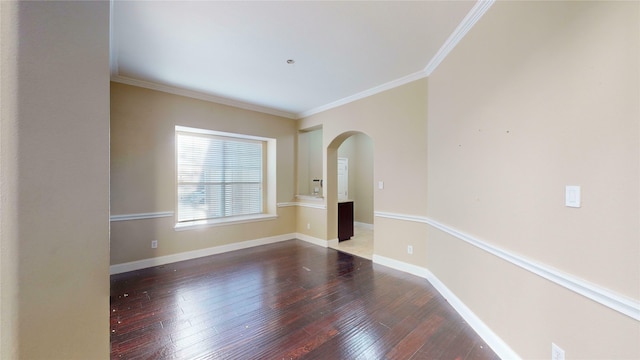 unfurnished room featuring wood-type flooring and ornamental molding