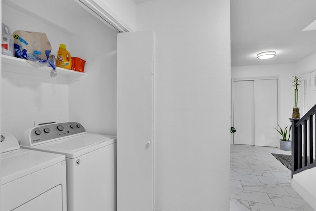 laundry room featuring washer and clothes dryer