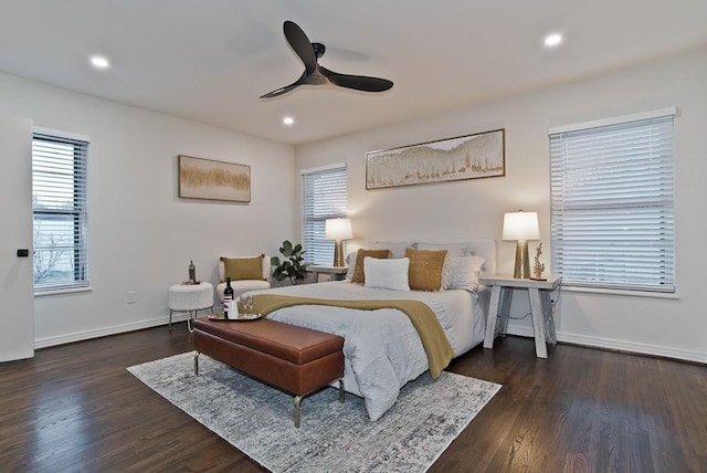 bedroom with ceiling fan and dark wood-type flooring