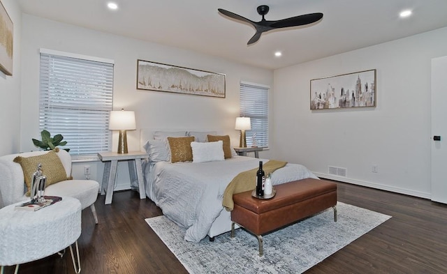 bedroom with dark wood-type flooring and ceiling fan