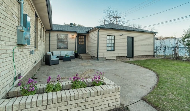 rear view of house featuring a patio area, a yard, and an outdoor hangout area