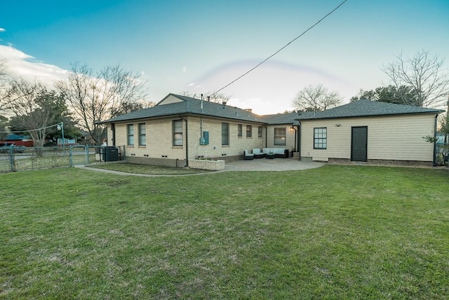 rear view of house with a patio area, a yard, and central air condition unit