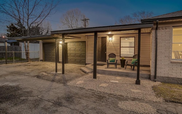 exterior space featuring a garage and a carport