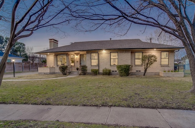 view of front of house with a lawn