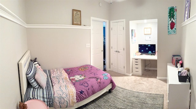 carpeted bedroom featuring a closet