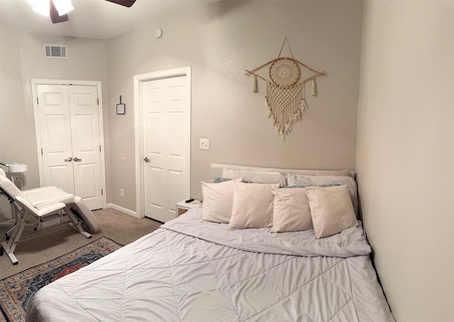 bedroom with ceiling fan, a closet, and carpet flooring