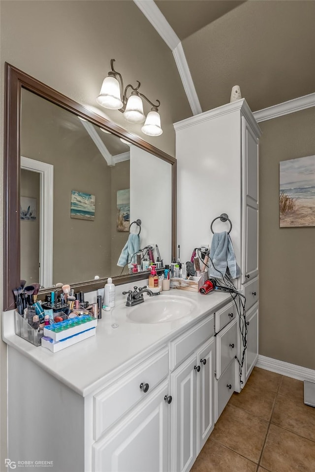 bathroom featuring vanity, tile patterned flooring, and ornamental molding