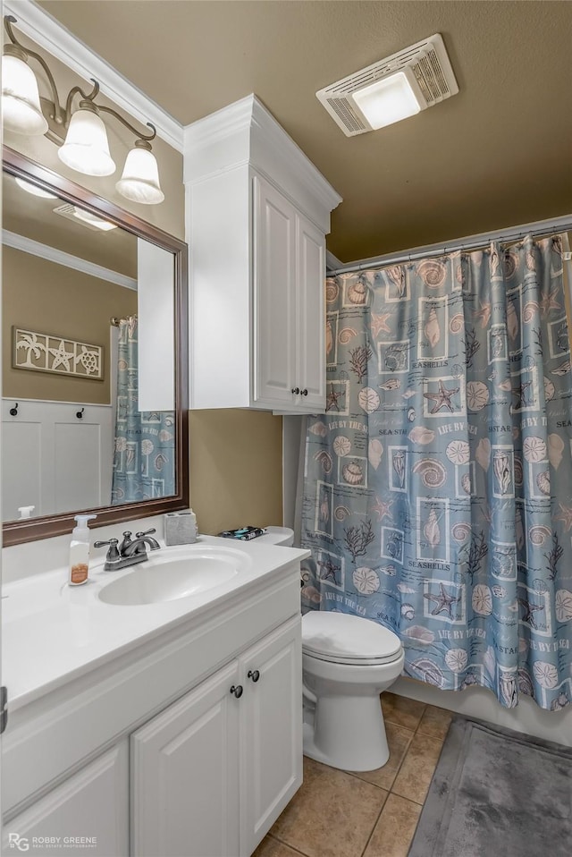 bathroom featuring tile patterned flooring, vanity, toilet, ornamental molding, and a shower with shower curtain