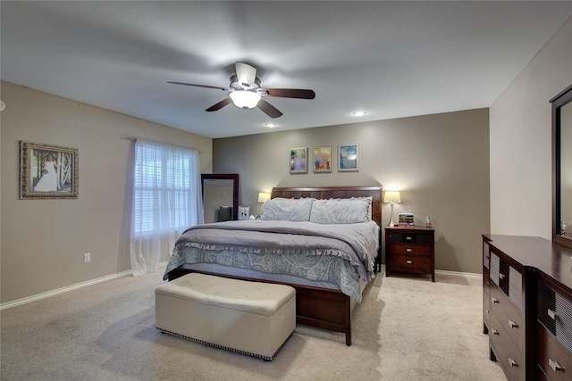 bedroom featuring light carpet and ceiling fan